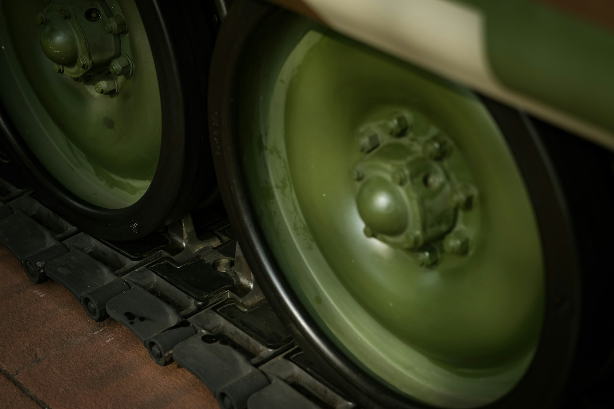 closeup military tank wheels.